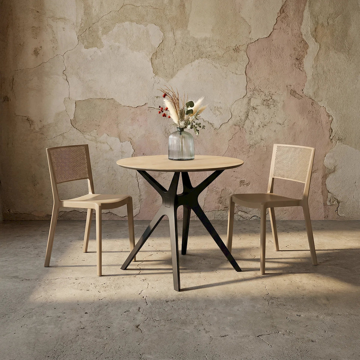 Resol Vela Table with a Natural Oak HPL top and black base, styled in an interior setting