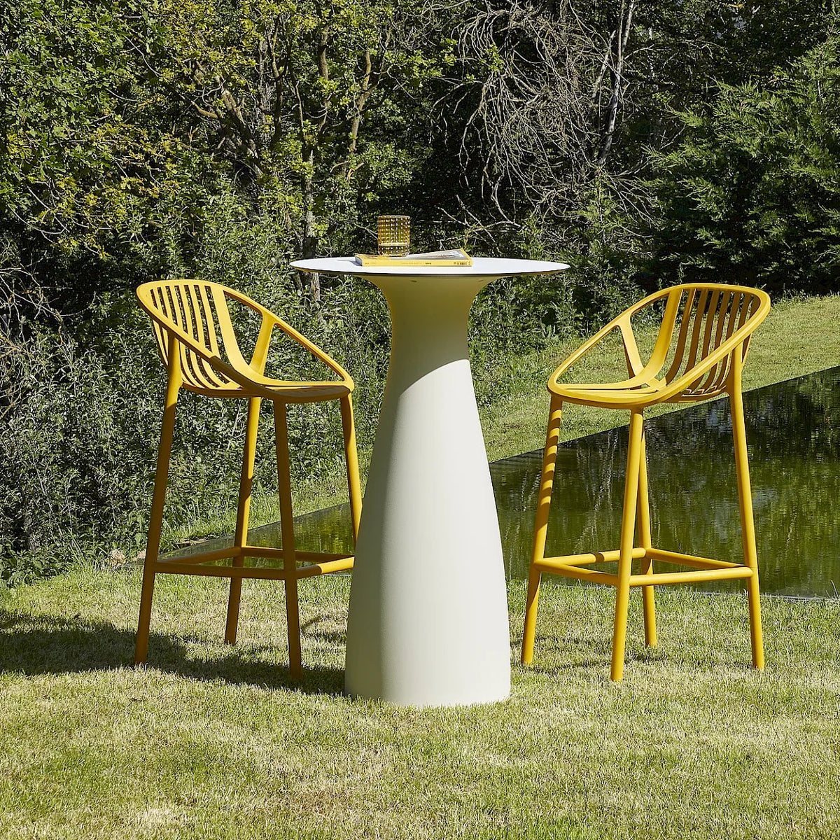 Resol Bini Bar Stools in Tuscan at a Baobab bar table, styled in a garden, polypropylene with fiberglass