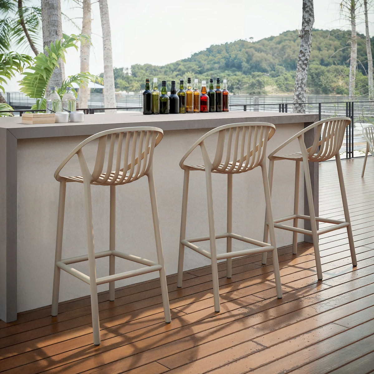 Resol Bini Bar Stools at an outdoor bar counter, styled in an outdoor setting, polypropylene with fiberglass