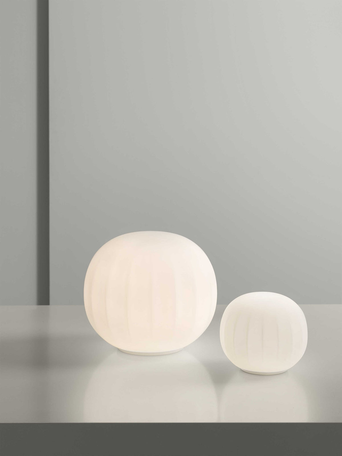 Luceplan Lita Stemless Table Lamps in two sizes, opal glass globes lit