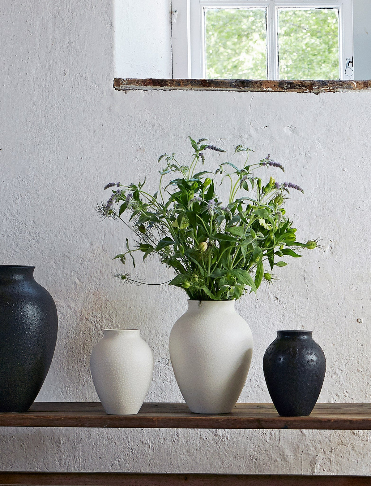 Knabstrup vases in several glazes, styled in an interior setting, glazed earthenware