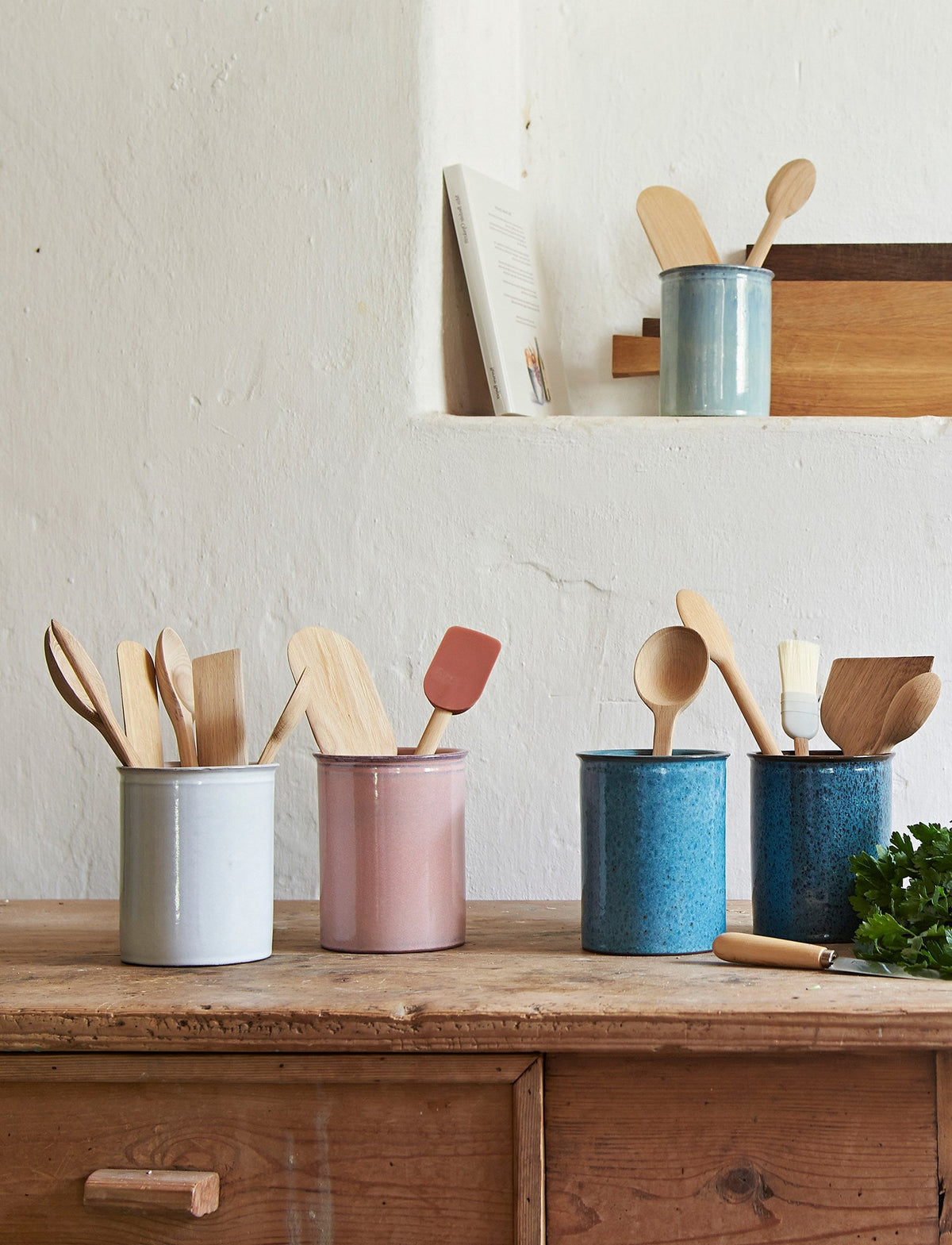 Knabstrup utensil holders and pots in several glazes, styled in an interior setting, glazed terracotta