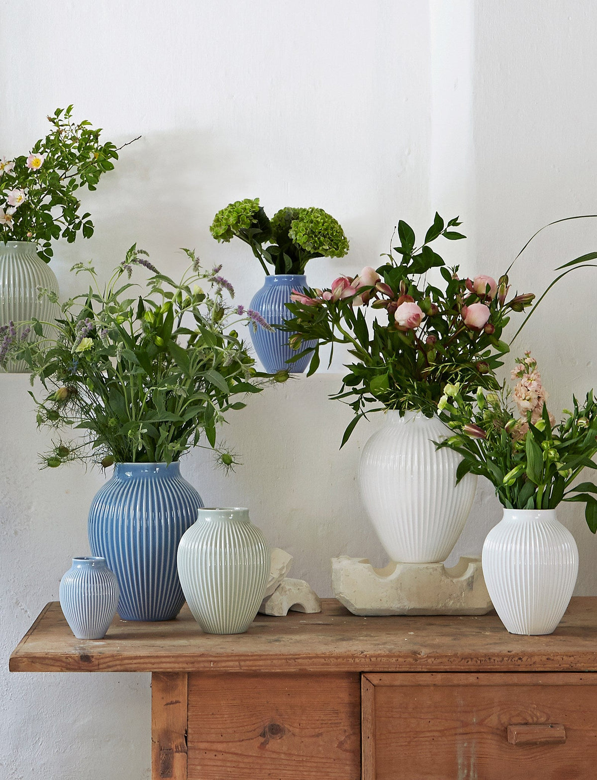 Knabstrup ripple vases in several glazes, styled in an interior setting, glazed earthenware