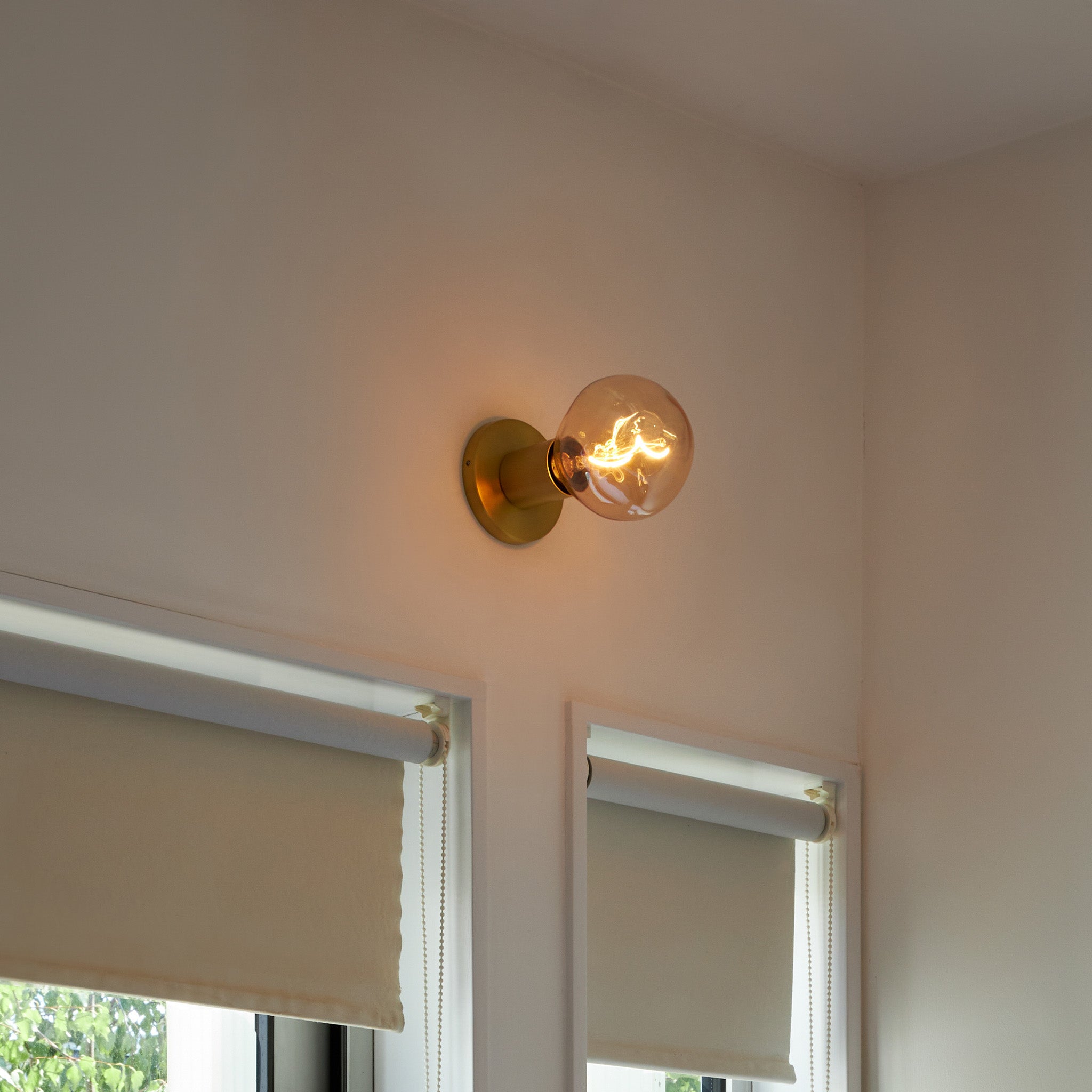 Lochan Wall Light in Brass with Voronoi I bulb, lifestyle setting