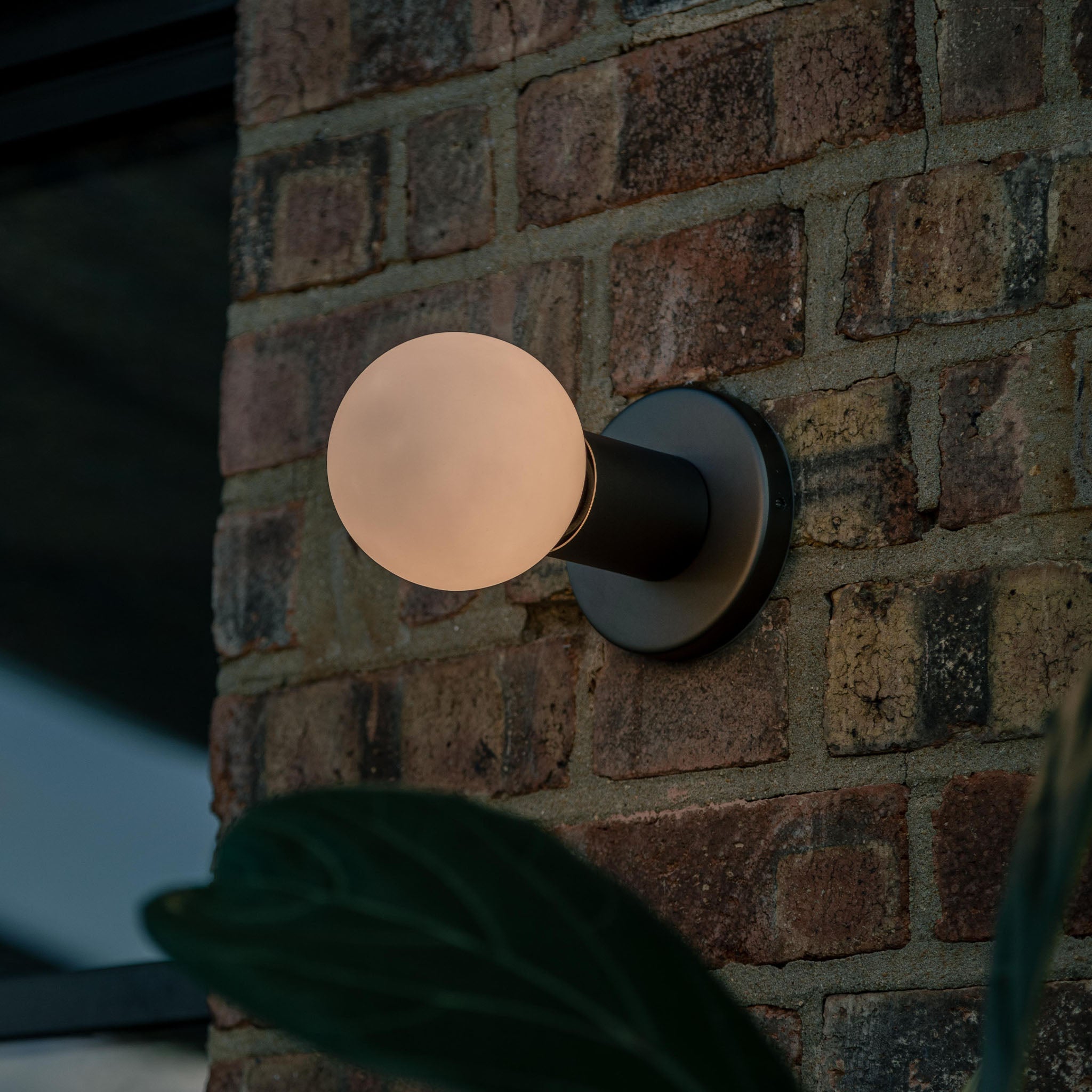 Lochan Wall Light in Graphite, studio exterior setting