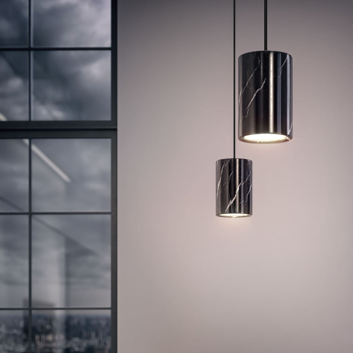 Two Case Solid Pendant cylinders in Nero Marquina, styled in an interior setting, Nero Marquina marble