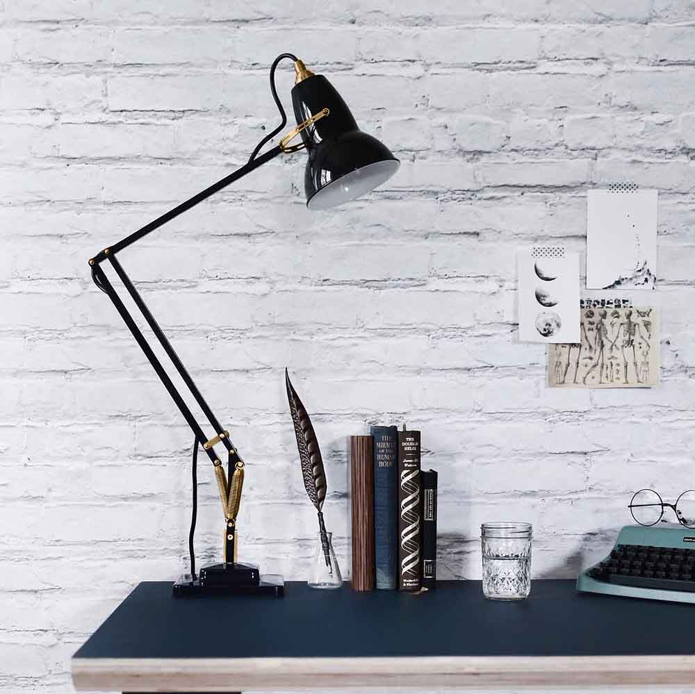 Anglepoise Original 1227 Brass Desk Lamp in Jet Black, styled in an interior setting, aluminum and brass