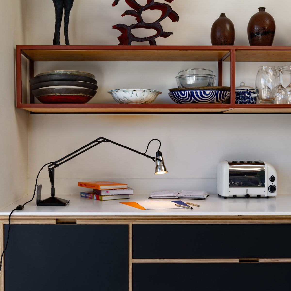 Anglepoise Original 315 Desk Lamp in Aluminum and Black, styled in an interior setting, polished aluminum