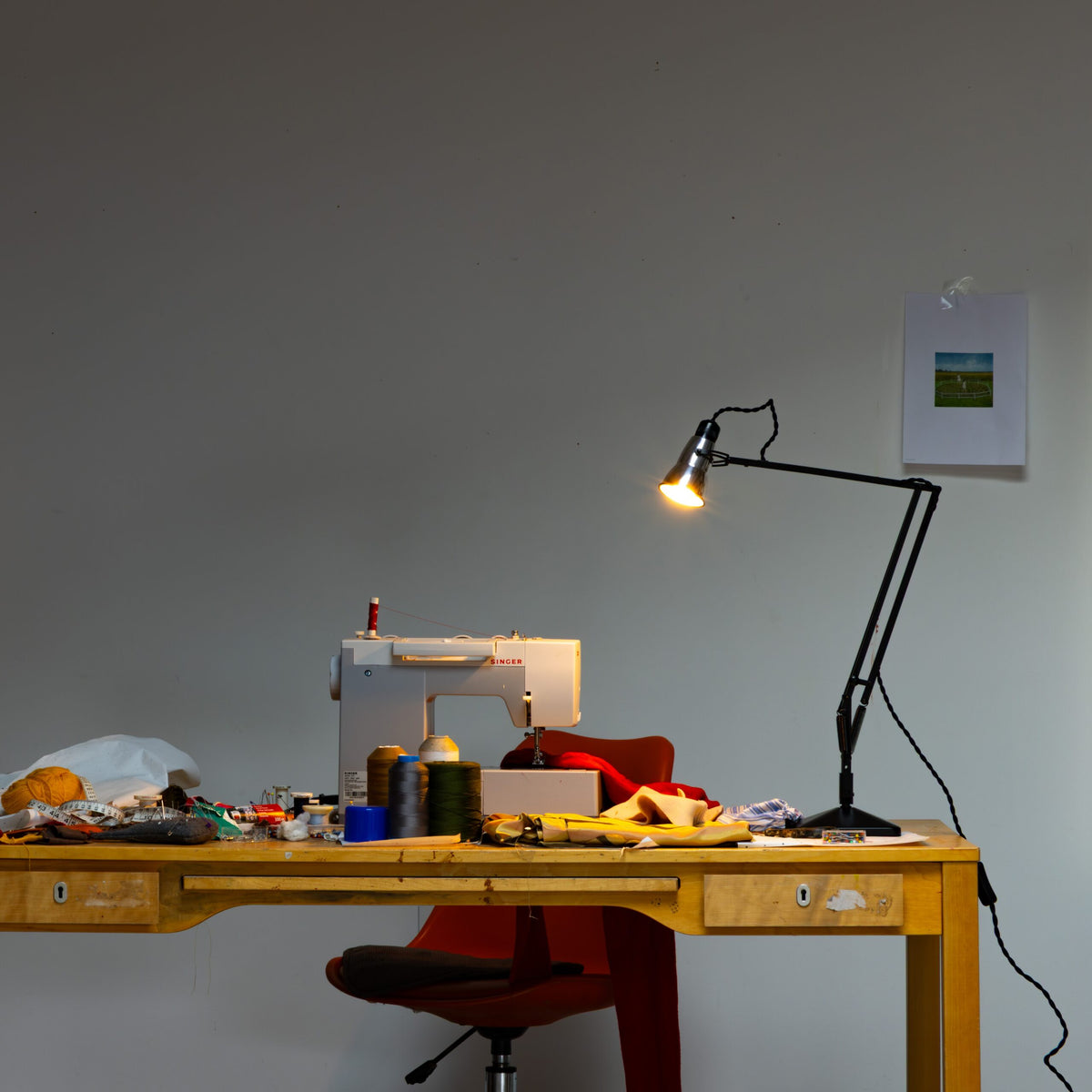 Anglepoise Original 315 Desk Lamp in Aluminum and Black, styled in an interior setting, polished aluminum