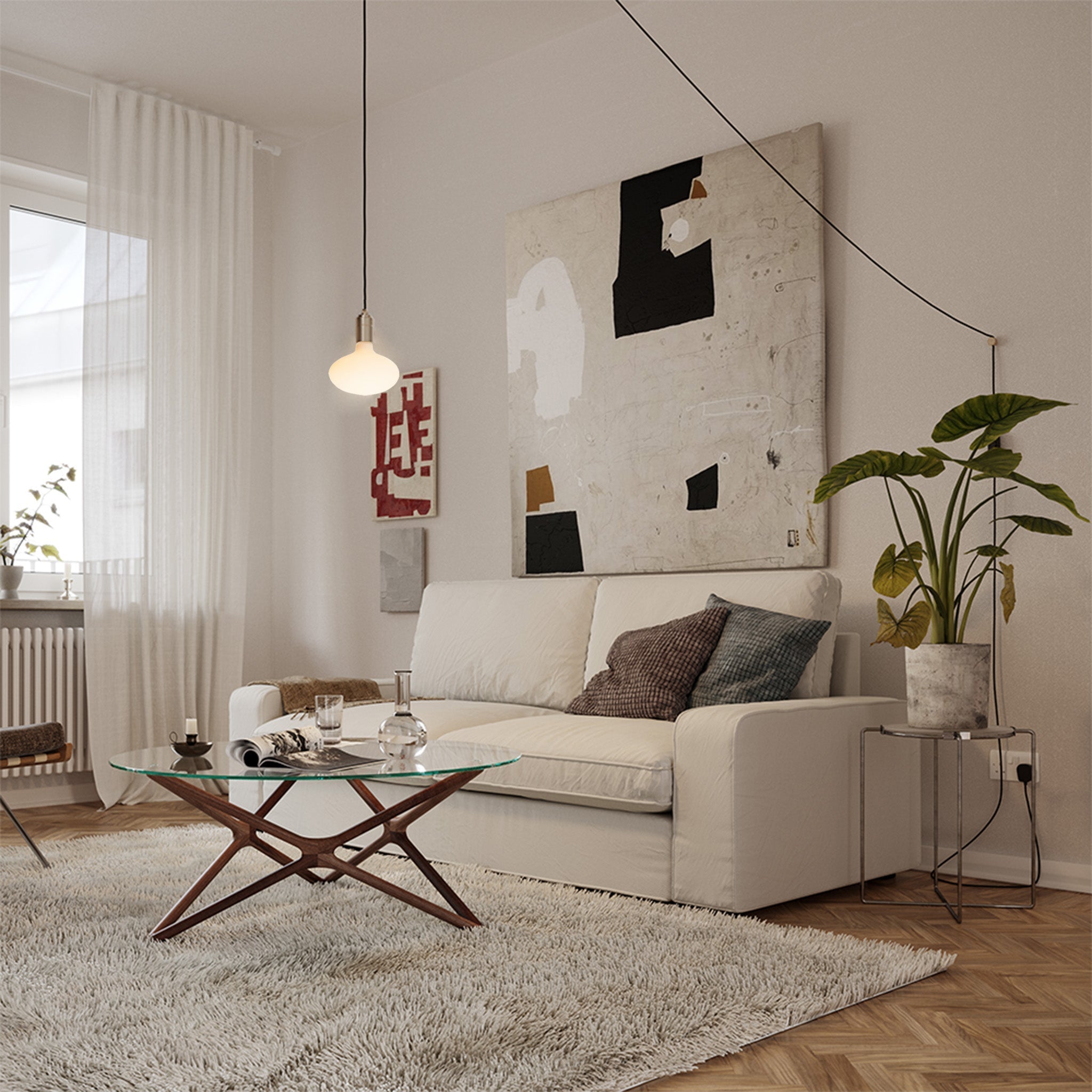 Oval Dim-to-Warm Plug-In Pendant by Tala — lifestyle, living room setting, graphite