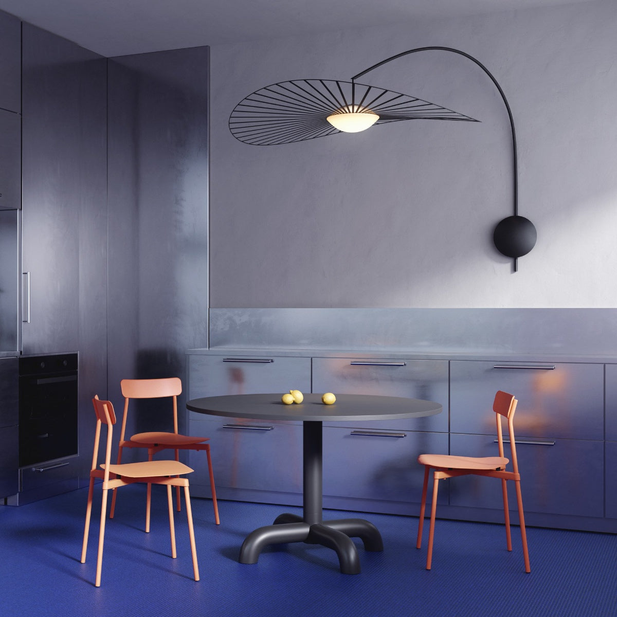 Petite Friture Vertigo Nova wall lamp in black above a round dining table