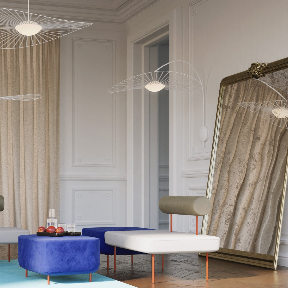 Petite Friture Vertigo Nova wall lamp in white in a living room with a blue pouf