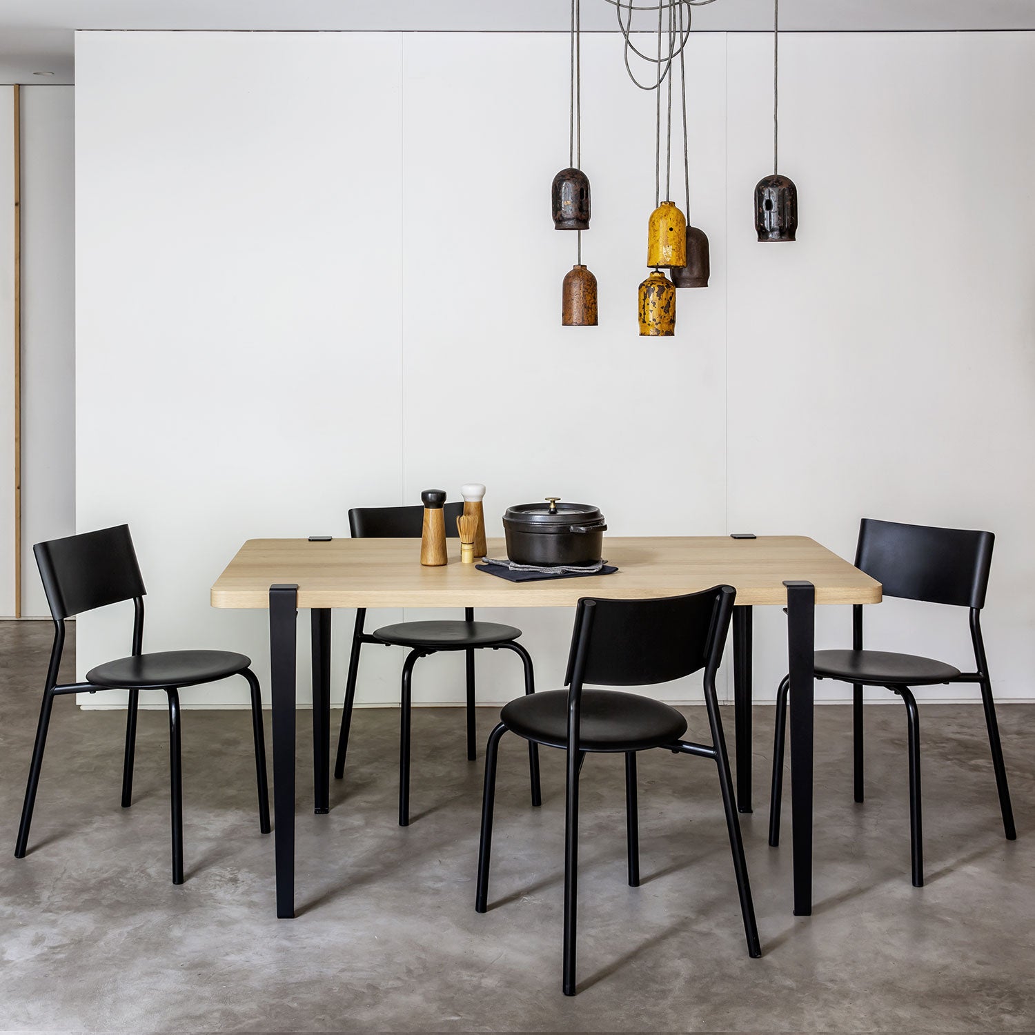Tiptoe Dining Table with Eco-Certified Wood Top lifestyle photograph