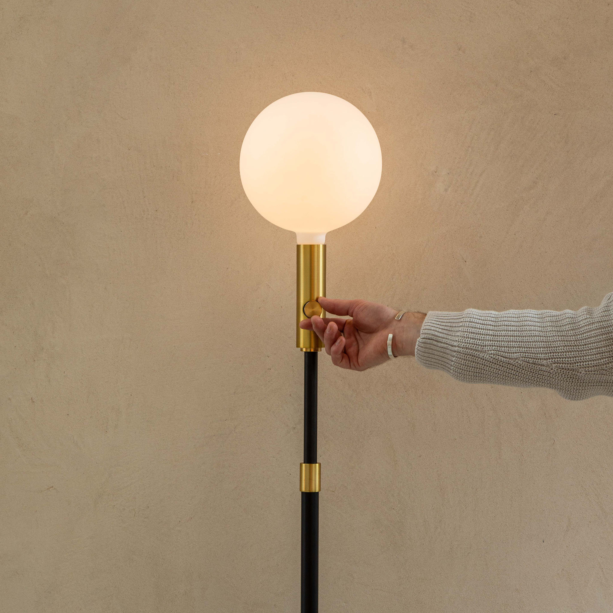 Tala Poise Adjustable Floor Lamp in Brass, extended tall with dimmer, lifestyle setting