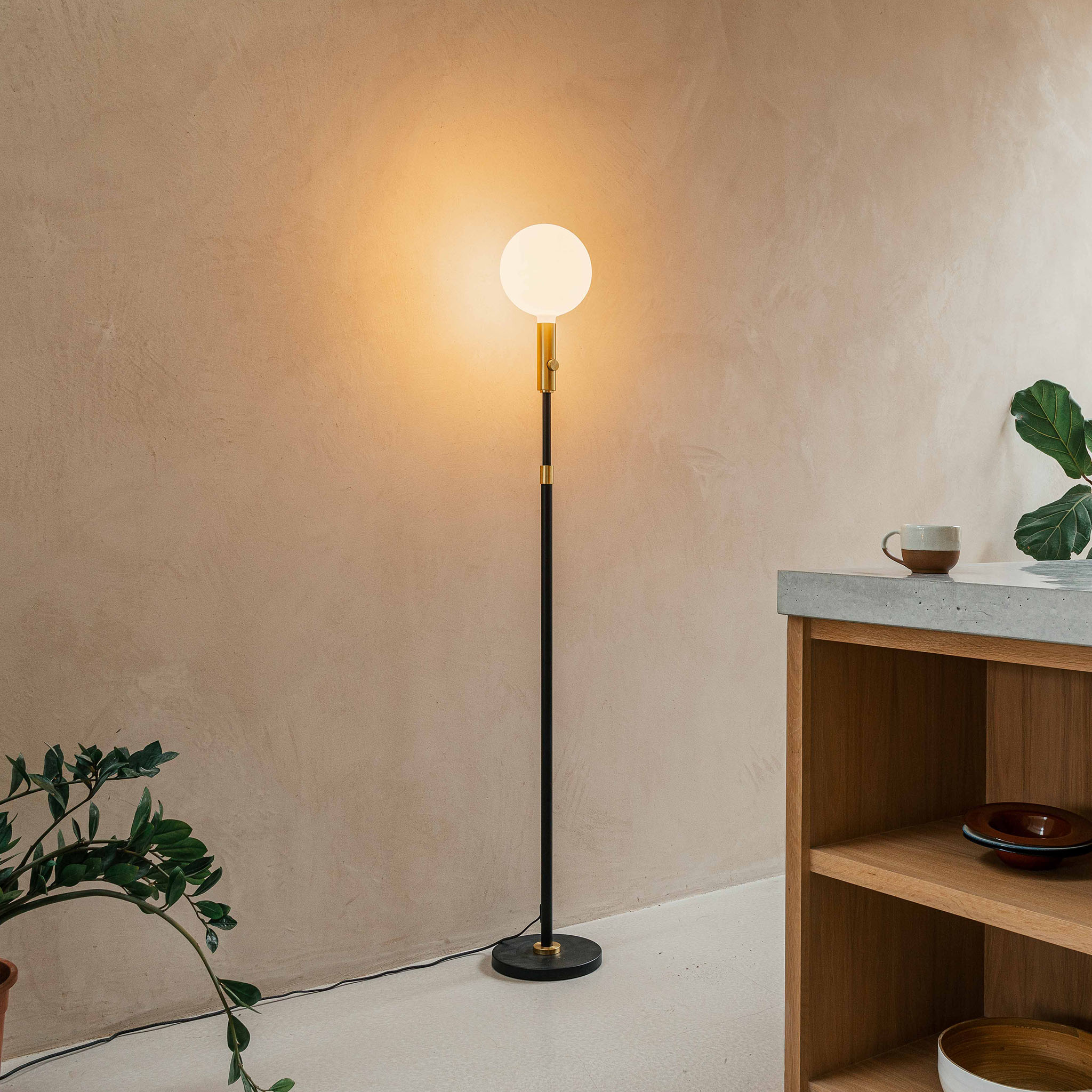 Tala Poise Adjustable Floor Lamp in Brass in a kitchen setting