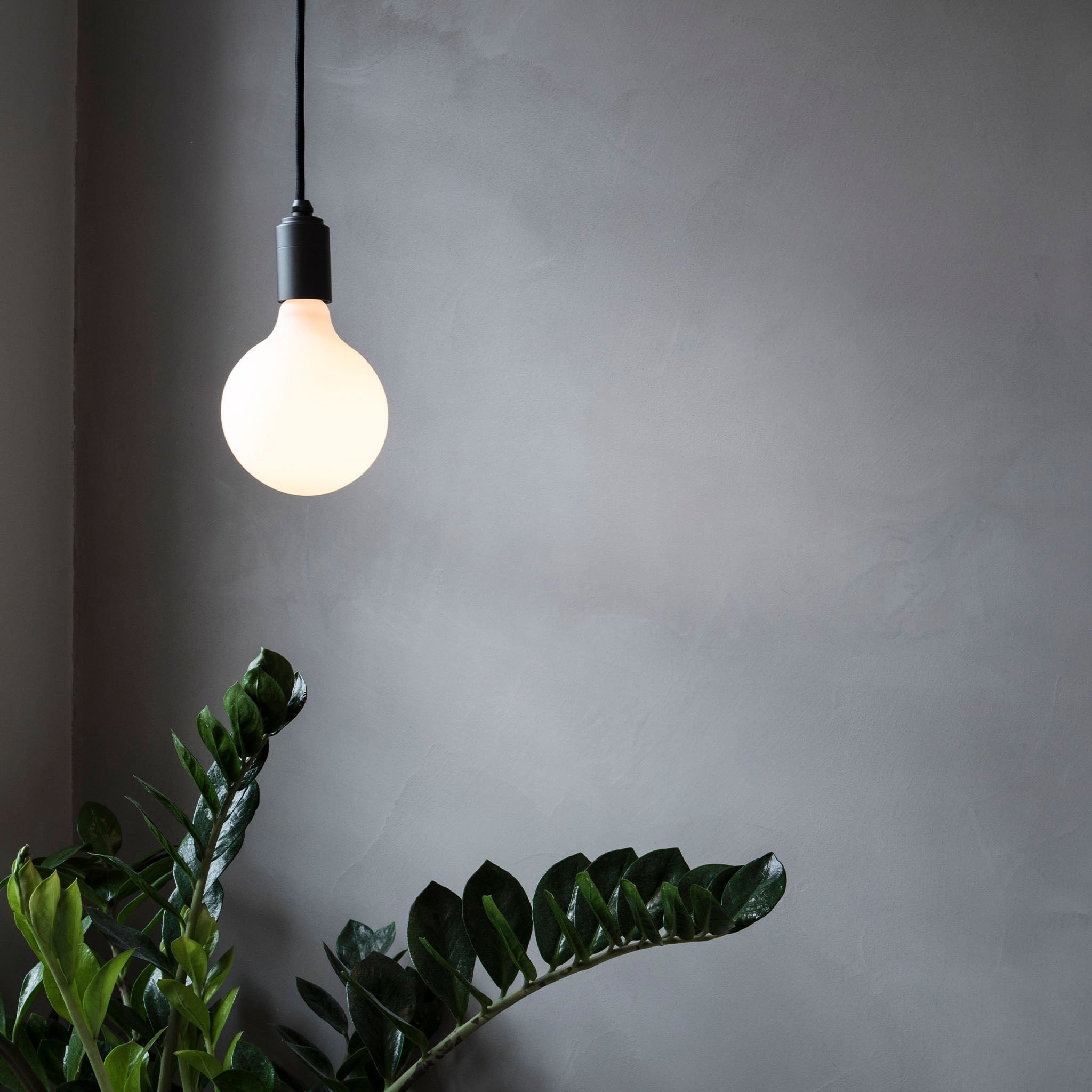 Graphite Pendant by Tala paired with the Porcelain Range in a living room