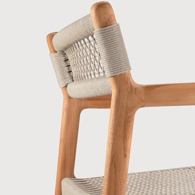 Ethnicraft Jack Woven Outdoor Dining Chair in teak styled in a dining room
