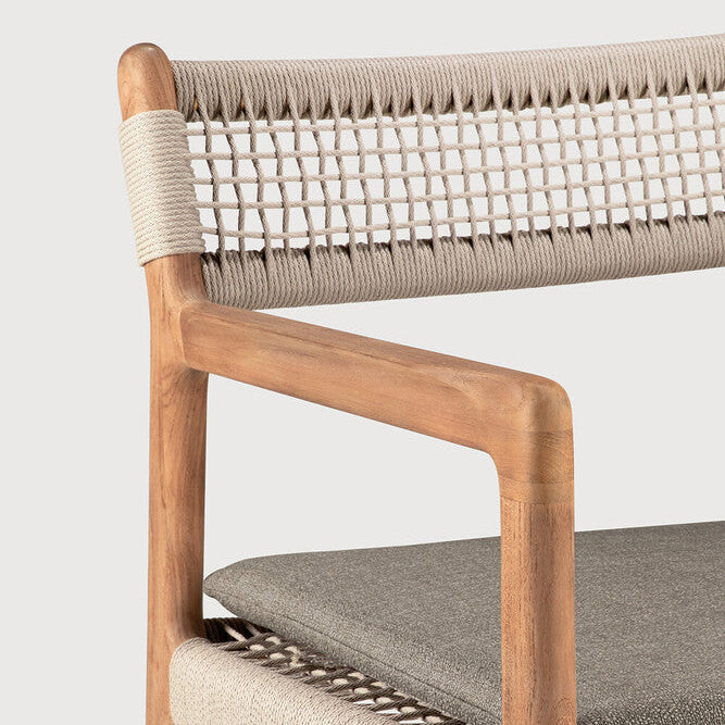 Ethnicraft Jack Woven Outdoor Dining Chair in teak styled in a dining room