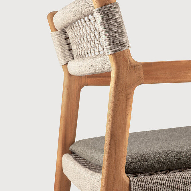 Ethnicraft Jack Woven Outdoor Dining Chair in teak styled in a dining room