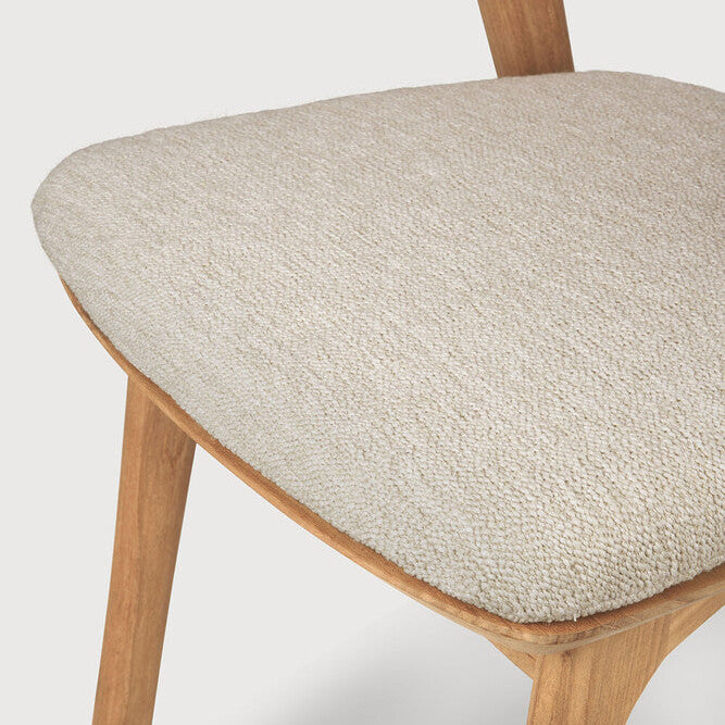 Ethnicraft Bok Outdoor Dining Chair in teak styled in a dining room