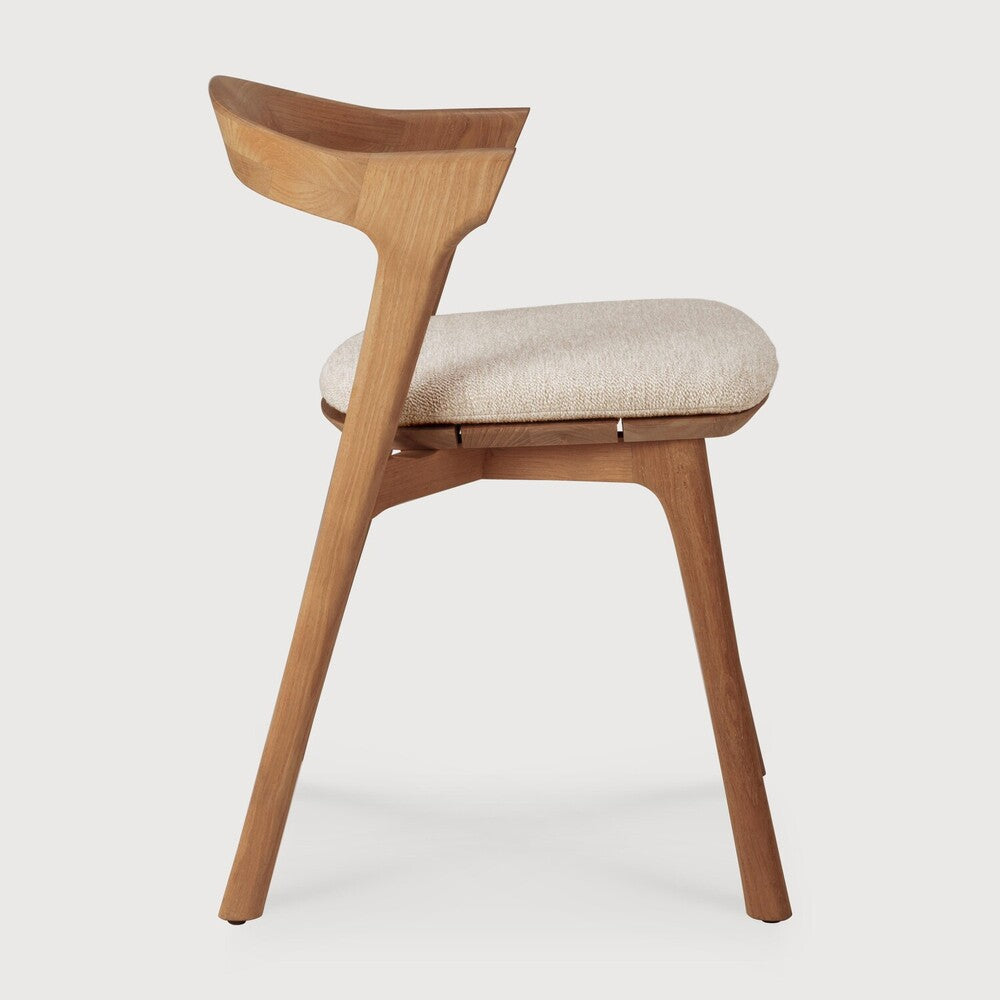 Ethnicraft Bok Outdoor Dining Chair in teak styled in a dining room