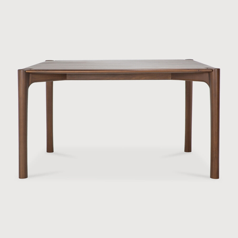 Ethnicraft PI Dining Table in teak styled in a dining room