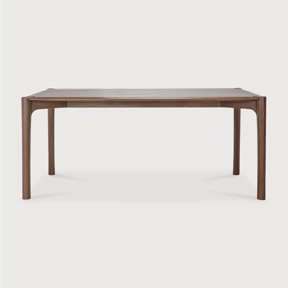 Ethnicraft PI Dining Table in teak styled in a dining room