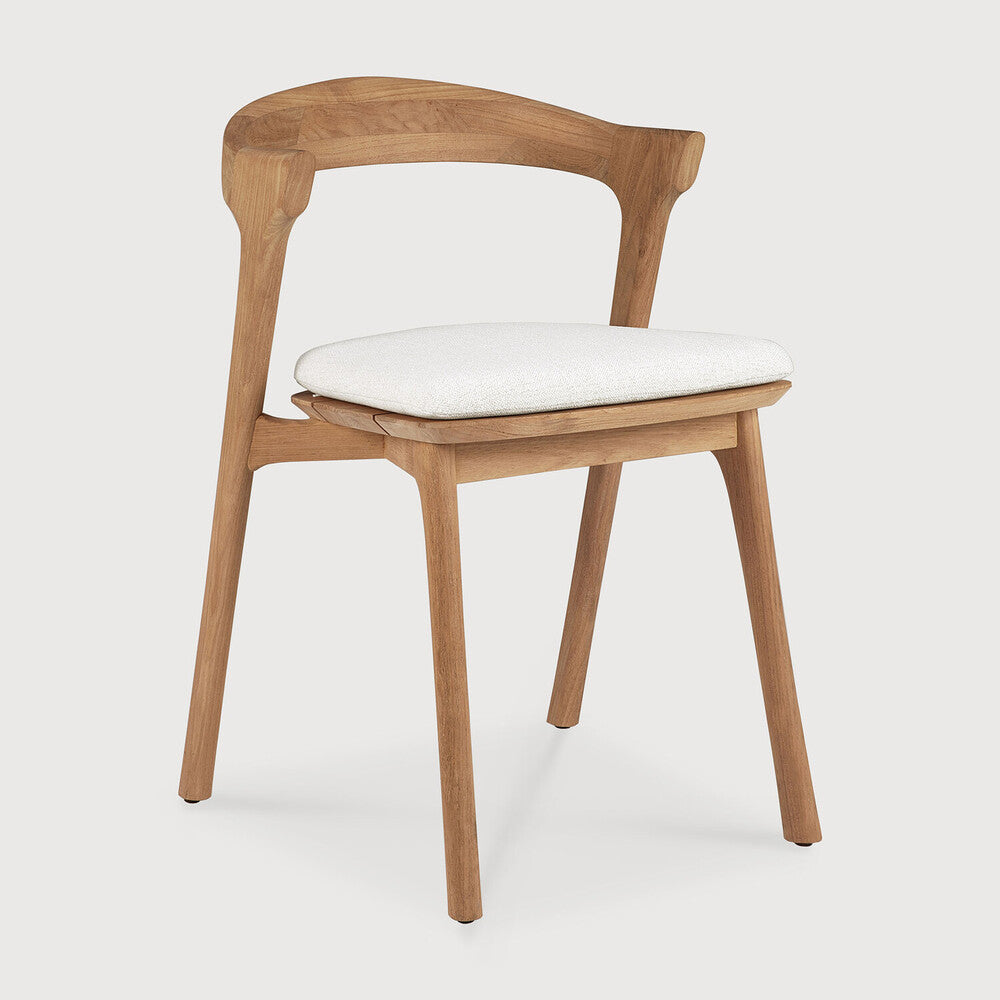 Ethnicraft Bok Outdoor Dining Chair in teak styled in a dining room