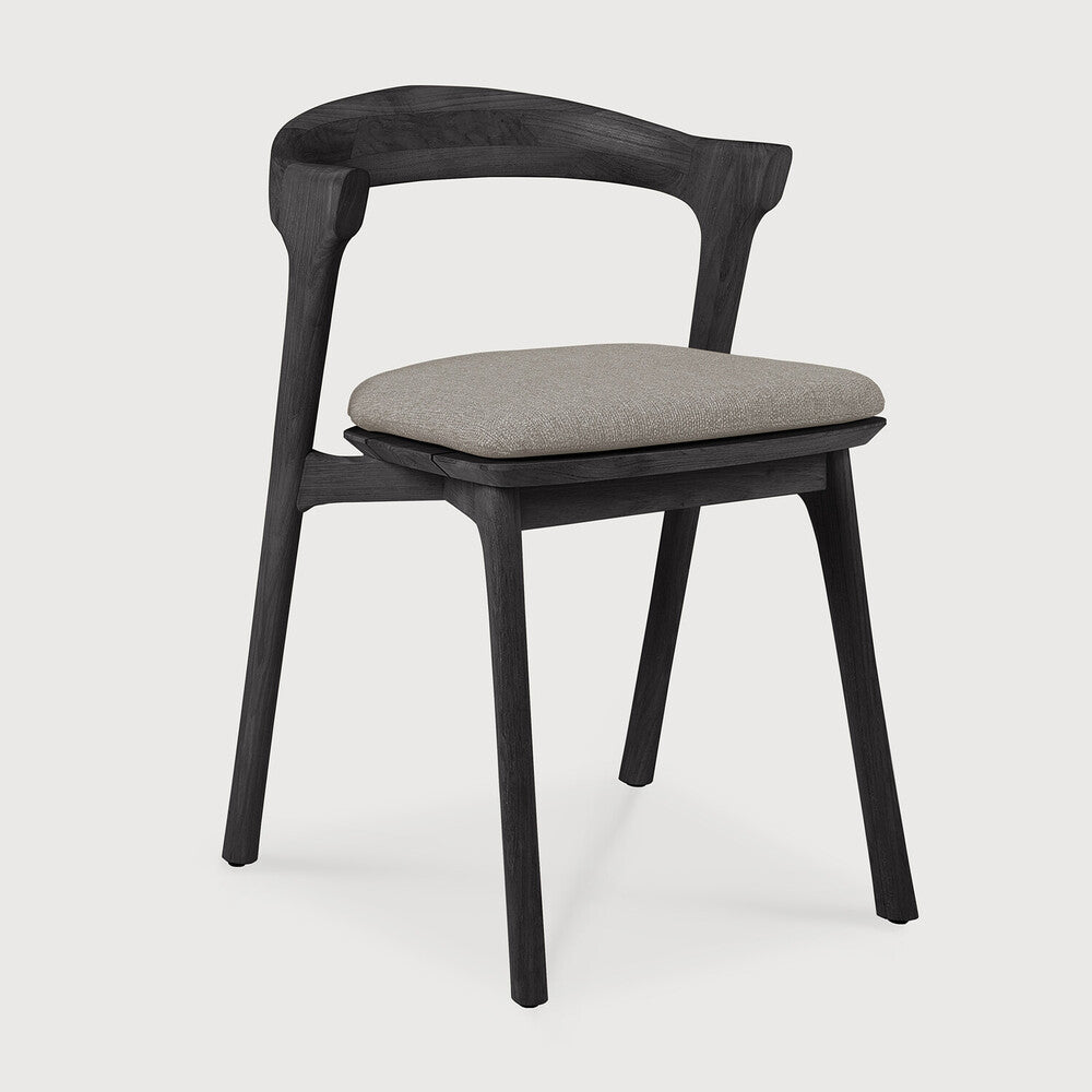 Ethnicraft Bok Outdoor Dining Chair in teak styled in a dining room