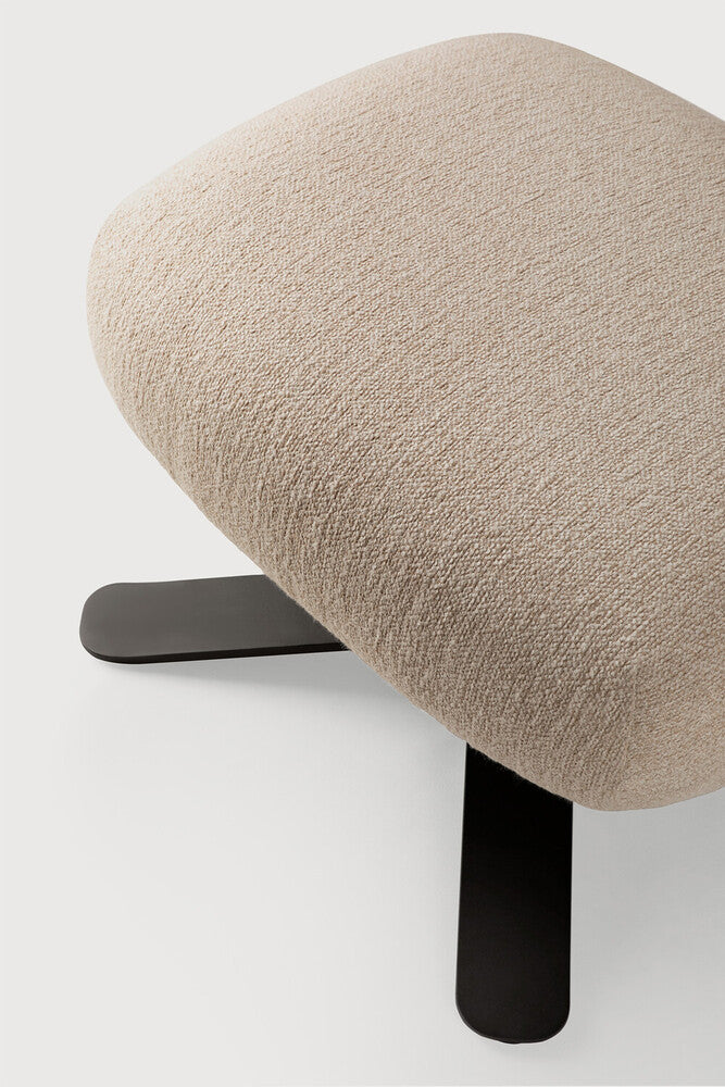 Detail of Ethnicraft Merge Footstool showing the upholstered edge and metal base