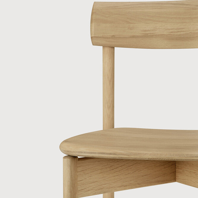 Ethnicraft Risu Dining Chair in oak styled in a dining room