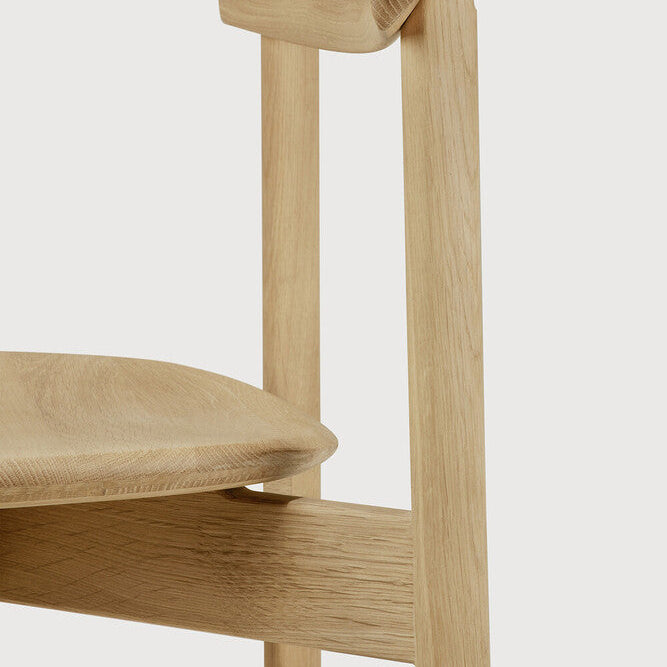 Ethnicraft Risu Dining Chair in oak styled in a dining room