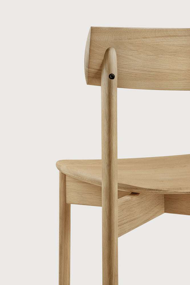 Ethnicraft Risu Dining Chair in oak styled in a dining room