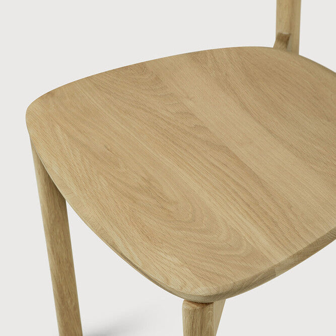 Ethnicraft Risu Dining Chair in oak styled in a dining room