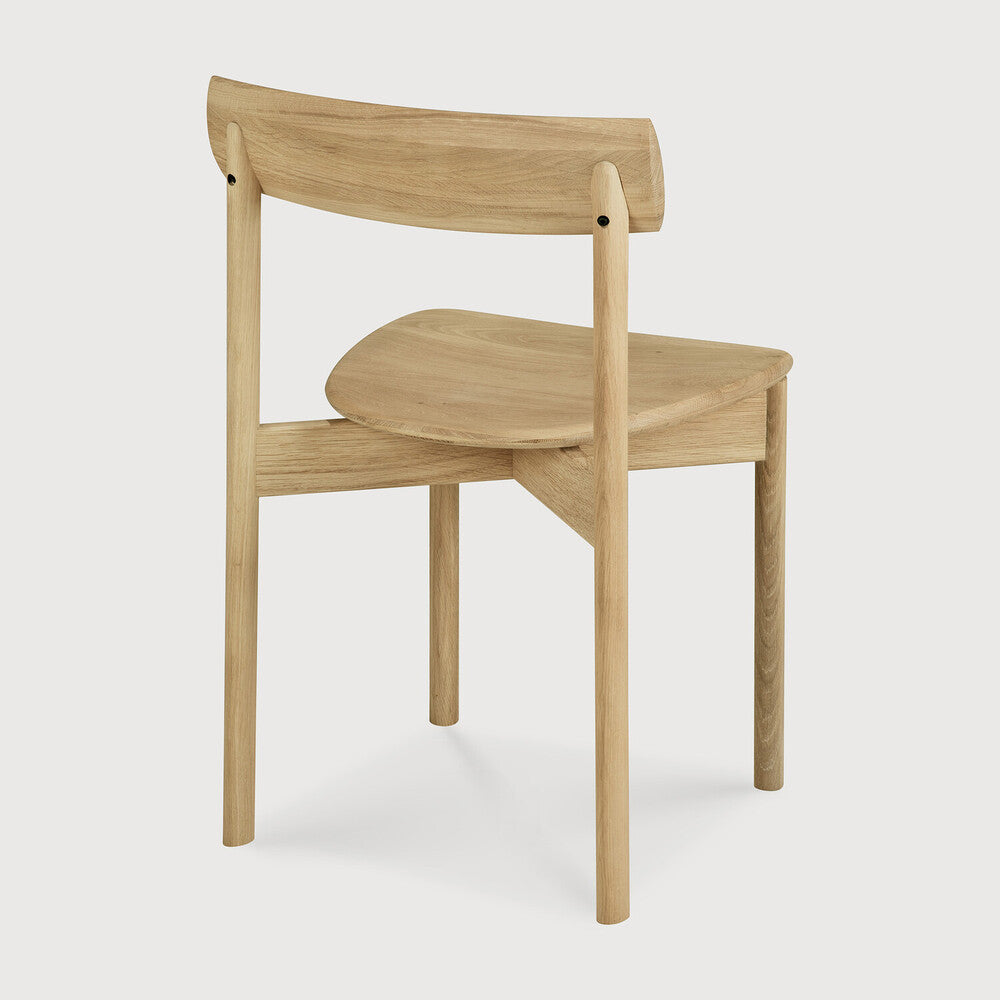 Ethnicraft Risu Dining Chair in oak styled in a dining room