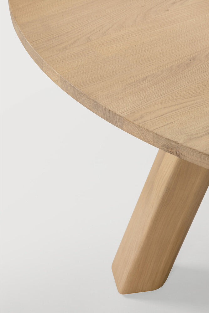 Detail of Ethnicraft Unda Dining Table showing the oiled oak top and rounded leg