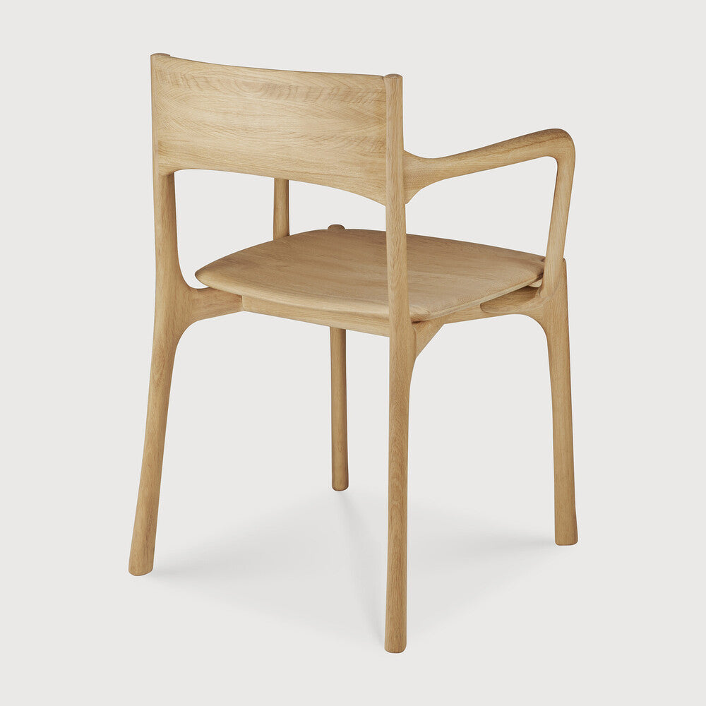 Ethnicraft Pi Dining Chair in oak styled in a dining room