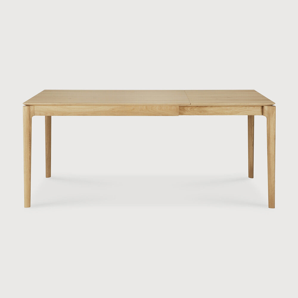 Ethnicraft Bok Extendable Dining Table in oak styled in a dining room