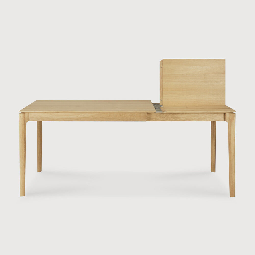 Ethnicraft Bok Extendable Dining Table in oak styled in a dining room