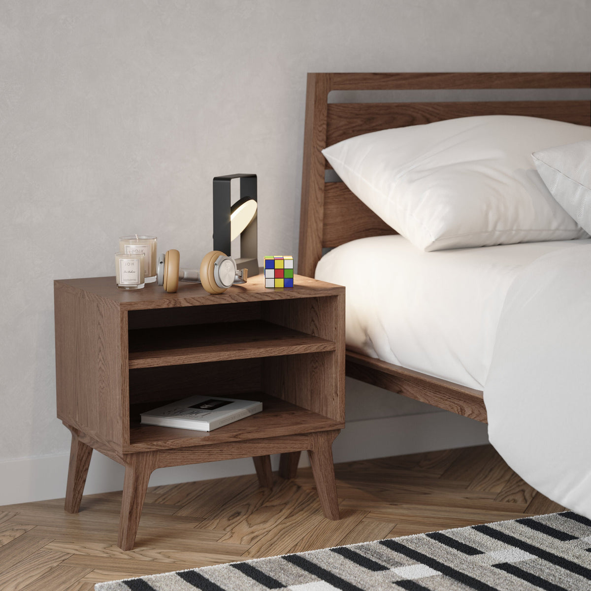 Case Valentine Bedside Table in Walnut Stain next to the Valentine Bed, styled in a bedroom, stained oak
