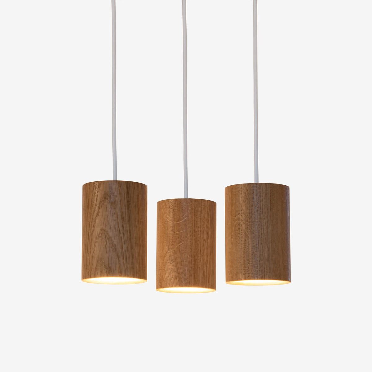 Case Solid Three Pendant Cluster in Oak, cylinders hung level, solid oak
