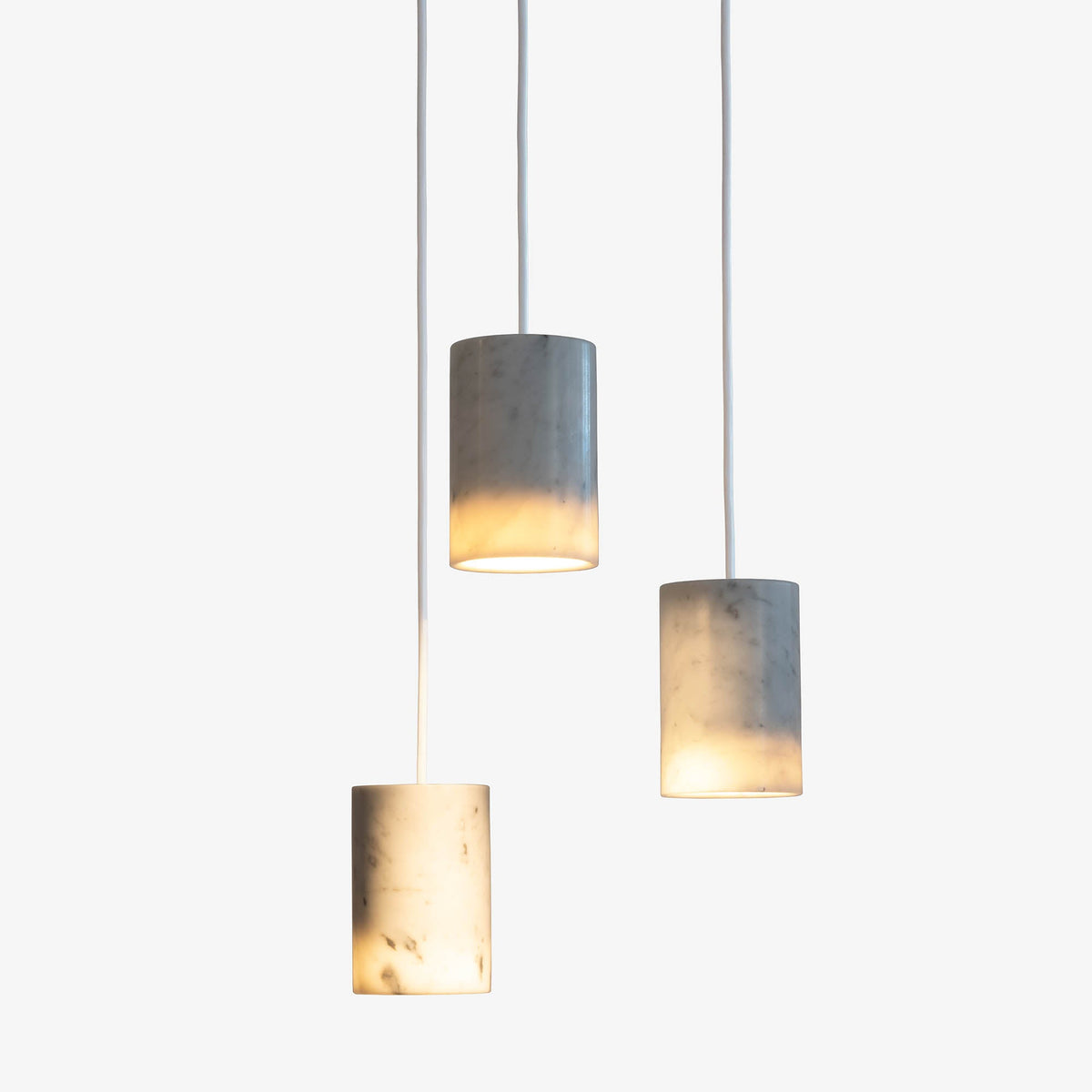 Case Solid Three Pendant Cluster in Carrara, staggered cylinders, Carrara marble