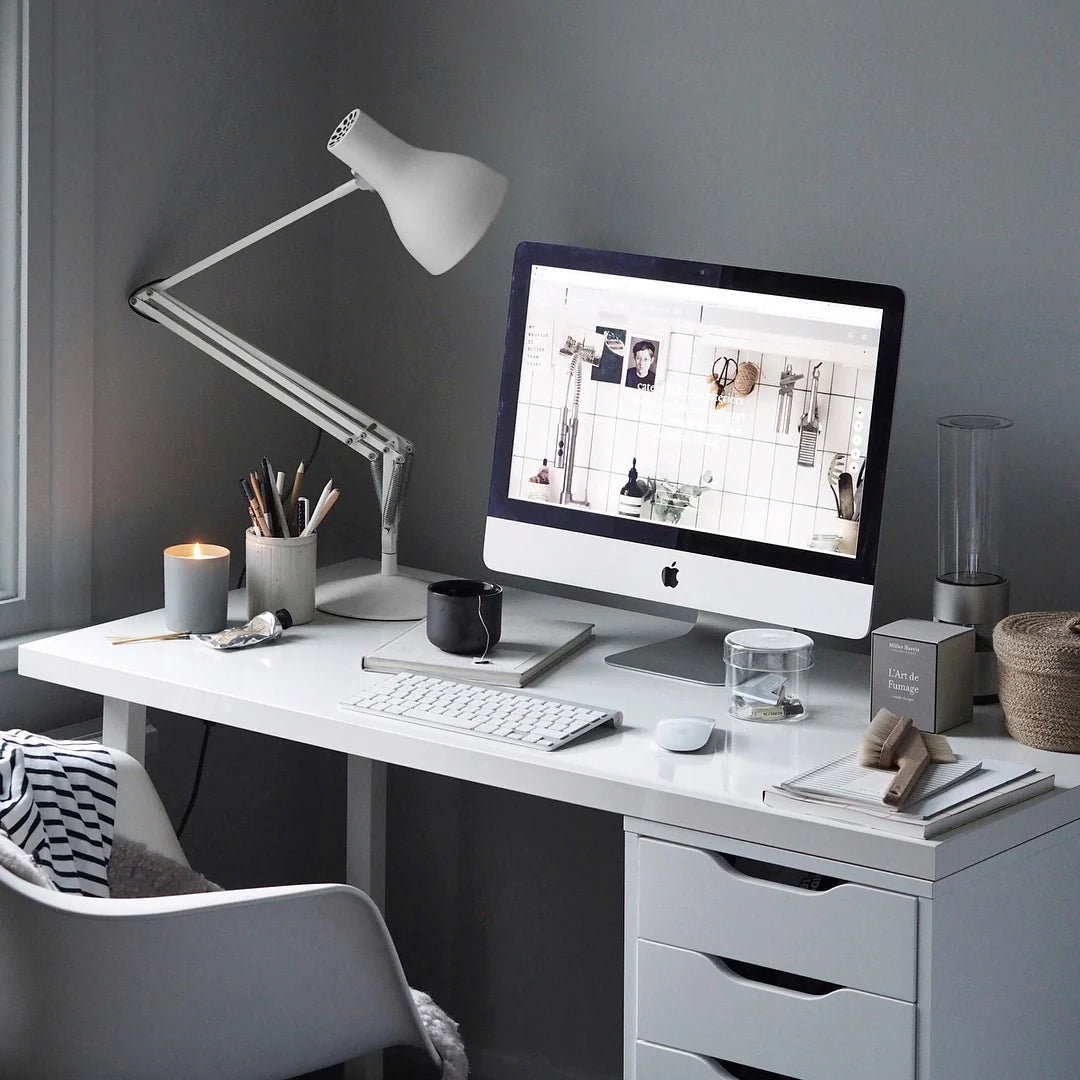 Anglepoise Type 75 desk lamp in Alpine White over a white desk with a computer