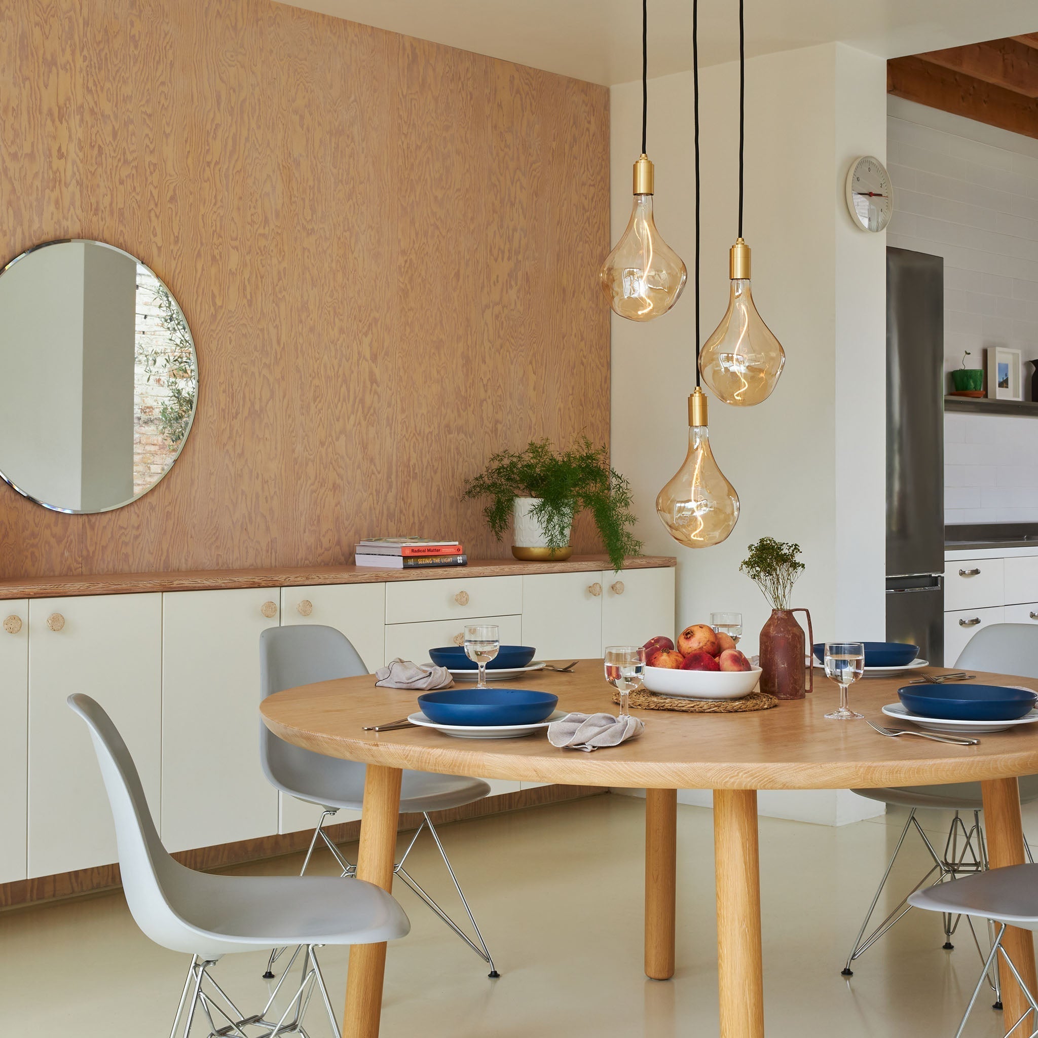 Tala Triple Pendant in Brass with Voronoi III bulbs — dining room lifestyle