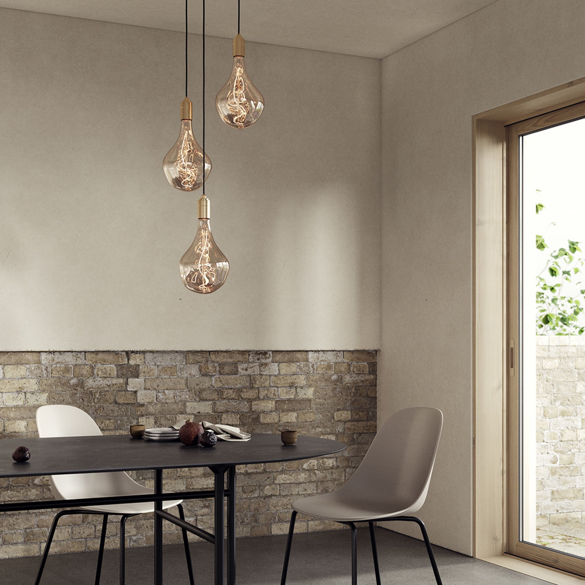 Tala Triple Pendant in Brass with Voronoi II bulbs — dining room lifestyle