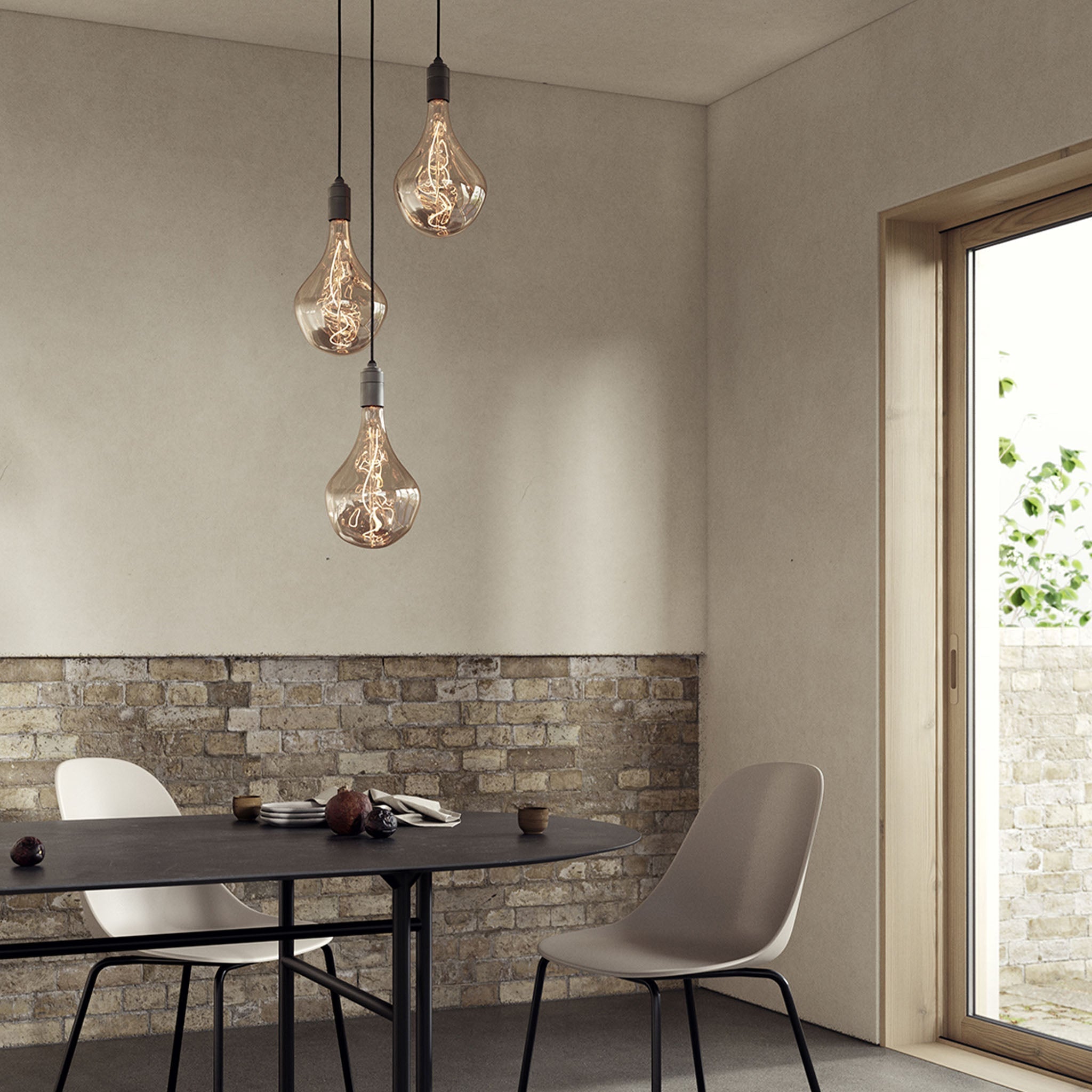 Tala Triple Pendant in Graphite with Voronoi II bulbs — dining room lifestyle