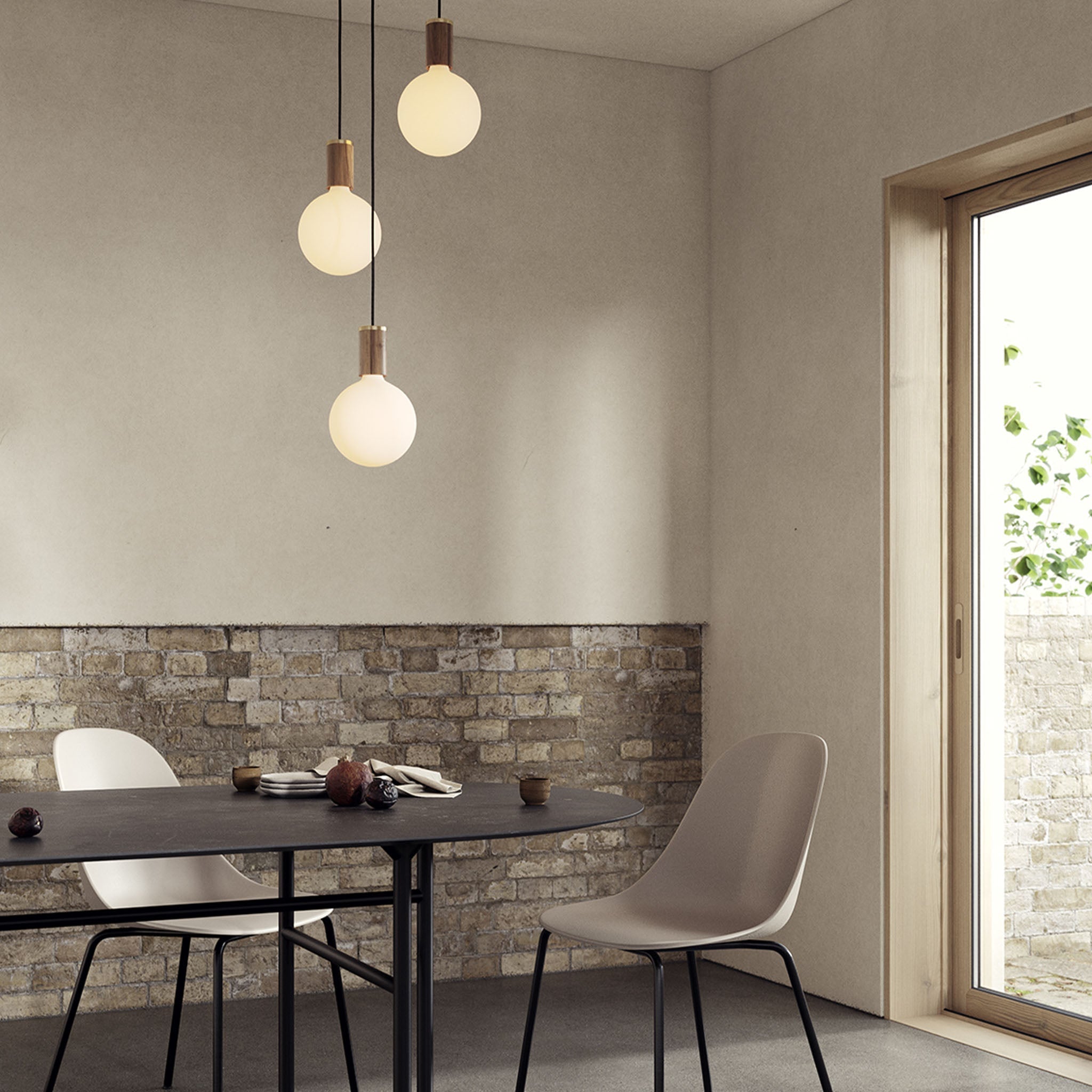 Tala Triple Pendant in Walnut with Sphere IV bulbs — dining room lifestyle